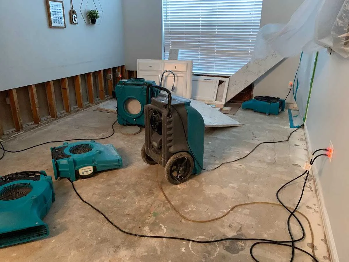 Dehumidifier in flood-cut room for Water Damage Restoration in Smithtown